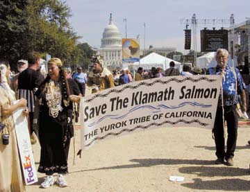 [Yurok tribal members holding banner that reads "Save the Klamath Salmon - The Yurok Tribe of California"]