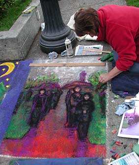 Linda working on her sidewalk pastel