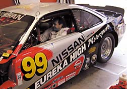 Larry Hansen sitting in race car