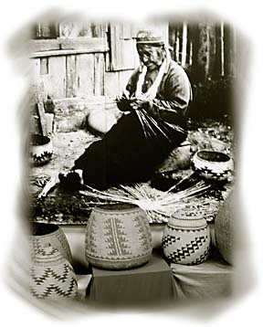 old photo of Native American woman making baskets with baskets in foreground
