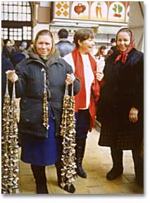 photo of women in Soviet food market with strings of mushrooms