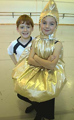 [photo of two children, one in dance costume]