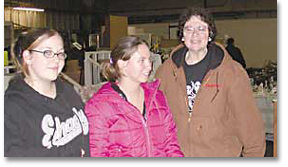 photo of Lori Jackson and her "flea market kids," Anita Caraway and Ashley Creel.