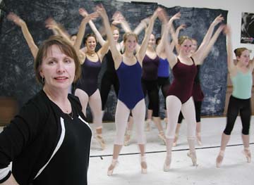 Virginia Neikrasz-Laurent in front of practicing dancers