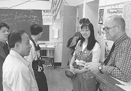 [photo of teachers in classroom]