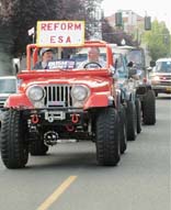 [people in jeep, holding sign "reform ESA"]